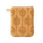 Gant de toilette Néroli curry avec motif végétal ciselé en relief et attache de suspension.