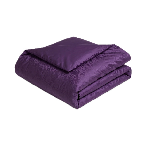 Housse de couette Magnolia en satin de coton jacquard, coloris violet, avec motif floral tissé dans la matière.